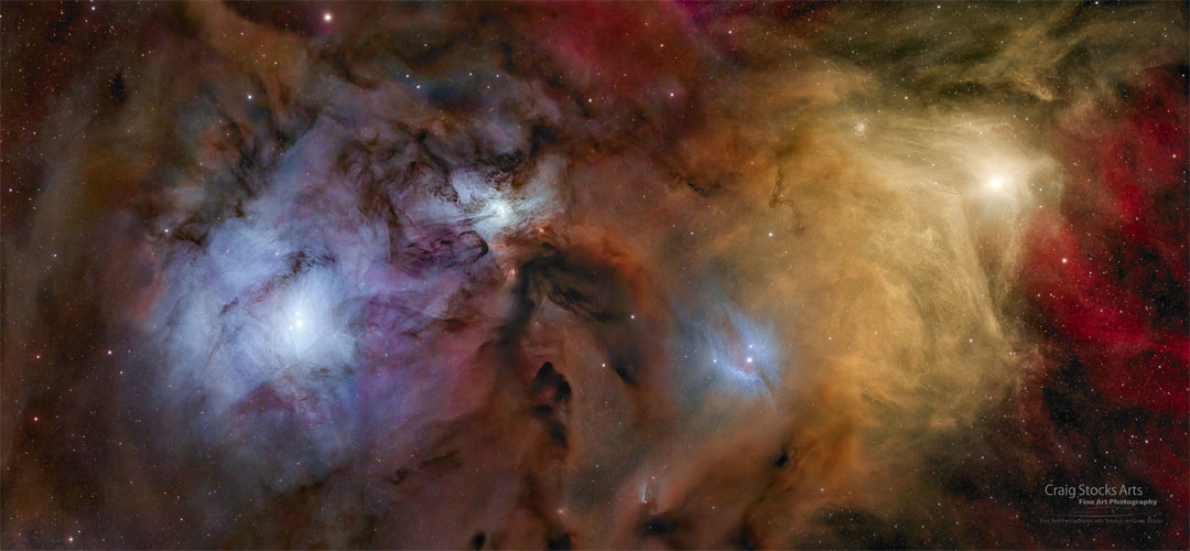 Colourful nebula and stars fill the wide images. The yellow star
Antares is visible on the left and blue reflection nebula surround
a central nebula and the nebula on the right surrounding the Rho
Ophiuchi star system. 
Please see the explanation for more detailed information.