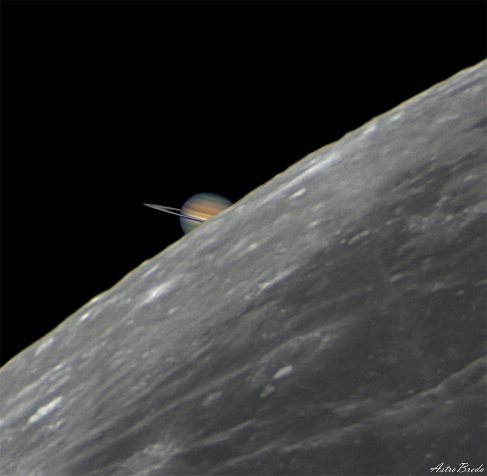 A picture of the edge of the Earth's familiar Moon 
takes up the right part of the frame, while a partial image
of Saturn is visible just behind it on the left. 
Please see the explanation for more detailed information.