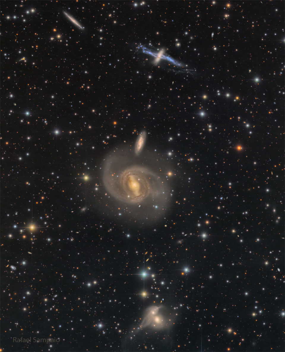 A dark starfield shows three pairs of galaxies. One pair
near the top, one near the middle, and one near the bottom.
Please see the explanation for more detailed information.