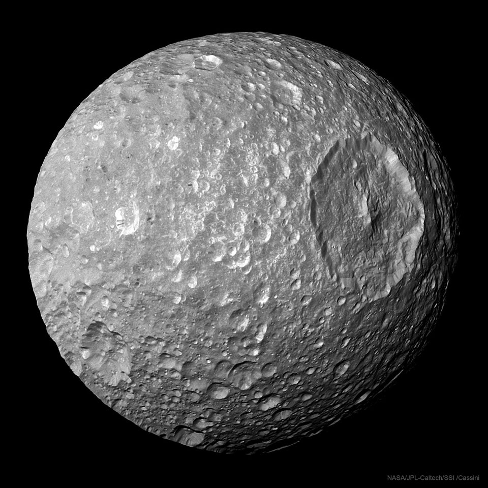 A cratered object is shown that shows on really large
crater on its right side.
Please see the explanation for more detailed information.