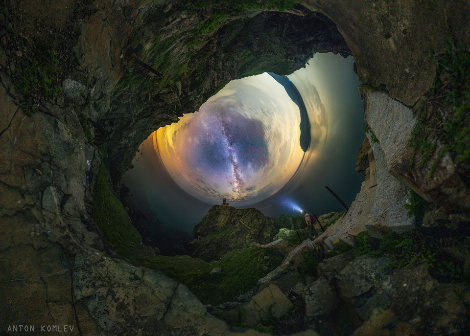 A fisheye image of the sky is shown on the left
with the landscape-foreground surrounding it. The plane of
our Milky Way Galaxy runs down the centre. At first glance
the sky looks like oddly like an eye of a dragon. 
Please see the explanation for more detailed information.